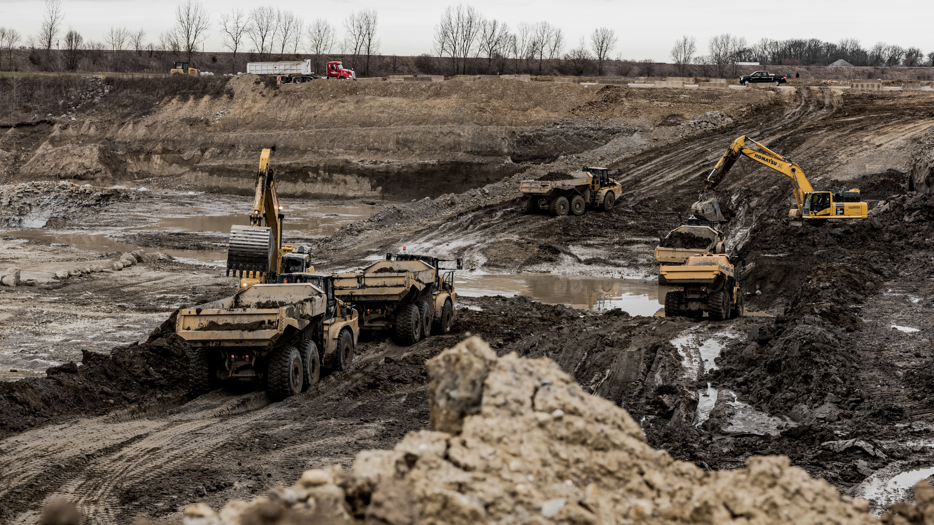 Construction Equipment scooping dirt